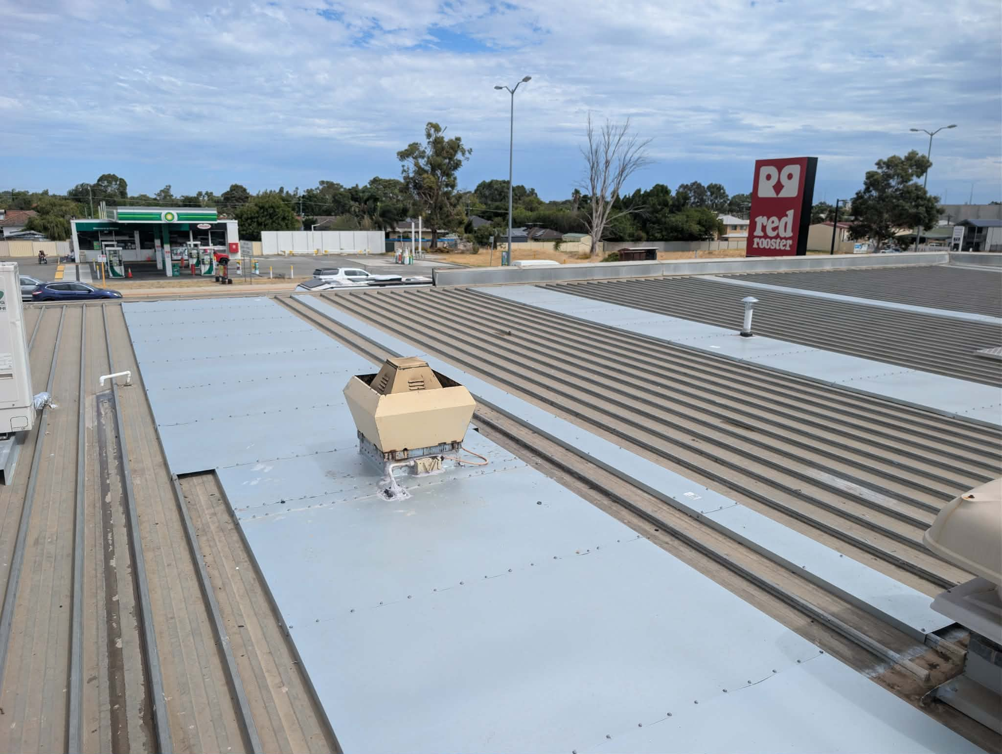 Roof recoating at Ampol service station, Midvale